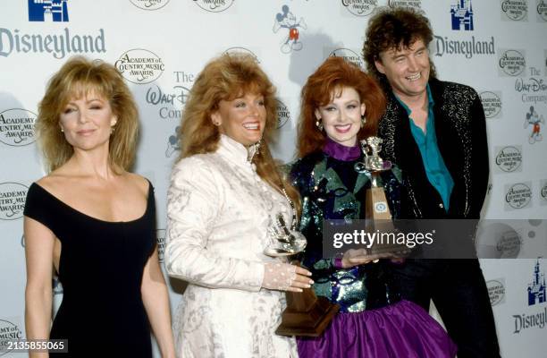 American actress and singer Lisa Hartman, country singers Wynonna Judd, Naomi Judd and Eddy Raven pose for a portrait during the 24th Annual Academy...