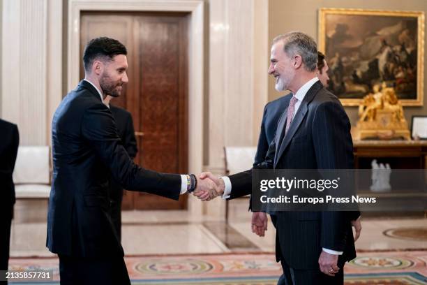 King Felipe VI greets Real Madrid player Rudy Fernandez during his audience with the Real Madrid basketball team at the Zarzuela Palace on April 3 in...