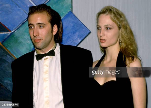 American actor and filmmaker Nicolas Cage and American actress Bridget Fonda attend an event in Los Angeles, California, circa 1989.