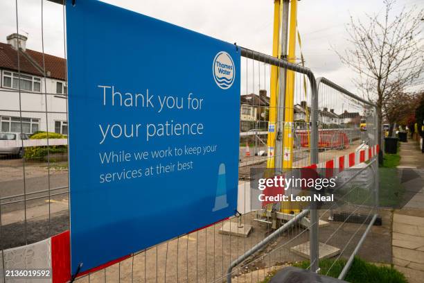 The Thames Water logo is seen on protective fencing around ongoing pipe work on April 03, 2024 in London, England. Last week, Thames Water...