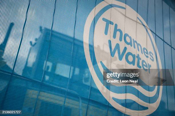 The Thames Water logo is seen on protective fencing around ongoing pipe work on April 03, 2024 in London, England. Last week, Thames Water...