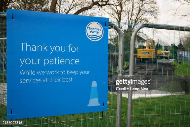 The Thames Water logo is seen on protective fencing around ongoing pipe work on April 03, 2024 in London, England. Last week, Thames Water...