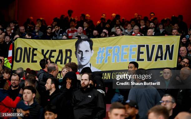 Fans display a banner in the stands, in support of Evan Gershkovich, American journalist and reporter during the Premier League match between Arsenal...