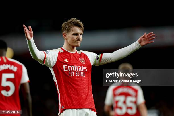 Martin Odegaard of Arsenal celebrates scoring his team's first goal during the Premier League match between Arsenal FC and Luton Town at Emirates...