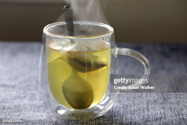 green tea in insulating cup - superfood stock pictures, royalty-free photos & images