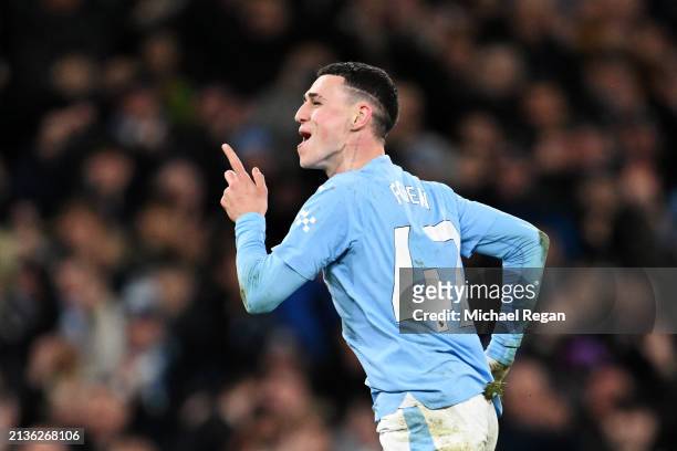Phil Foden of Manchester City celebrates scoring his team's fourth goal, his hat-trick, during the Premier League match between Manchester City and...
