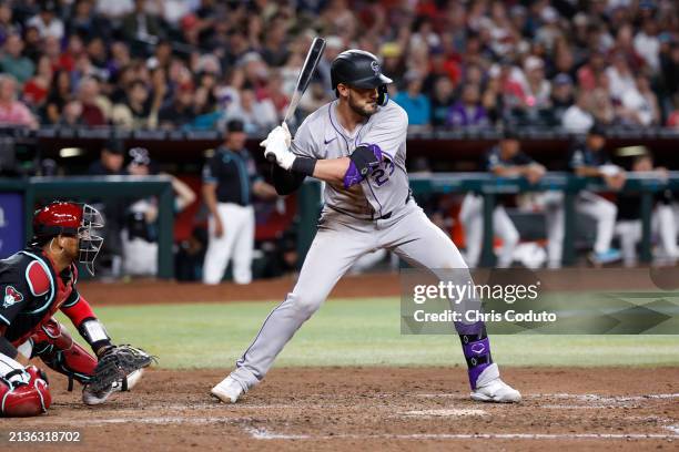 Kris Bryant of the Colorado Rockies bats during the game against the Arizona Diamondbacks at Chase Field on March 30, 2024 in Phoenix, Arizona.