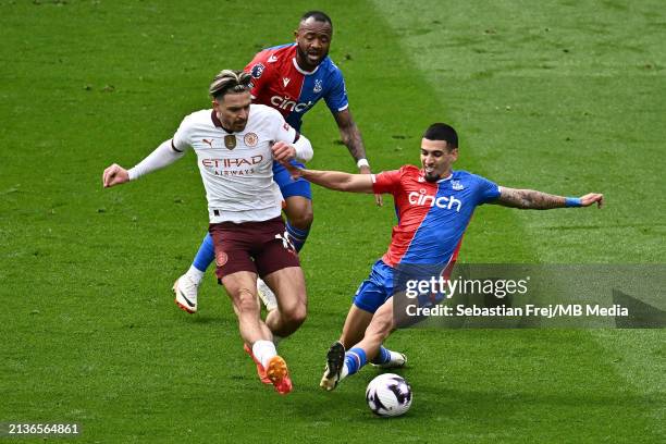 Jack Grealish of Manchester City and Daniel Munoz, Jordan Ayew of Crystal Palace battle for the ball during the Premier League match between Crystal...