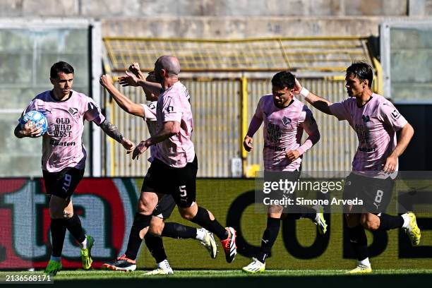 Matteo Brunori of Palermo celebrates with his team-mates after scoring a goal on a penalty kick during the Serie B match between Palermo and UC...