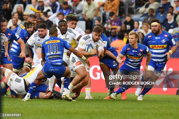 La Rochelle's hooker Quentin Lespiaucq Brettes runs with the ball during their Champions Cup Round of 16 rugby match against the Stormers at Cape...