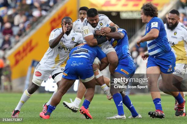 Tolu Latu of La Rochelle is picked up and carried back by Joseph Dweba of Stormers during the Investec Champions Cup match between Stormers and La...