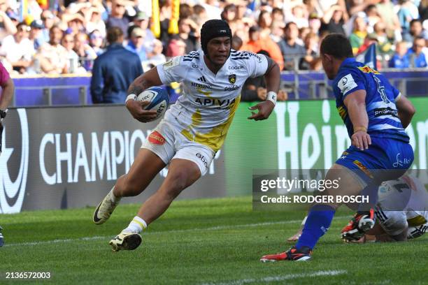 La Rochelle's centre Ulupano Seuteni runs with the ball the ball during their Champions Cup Round of 16 rugby match against the Stormers at Cape Town...