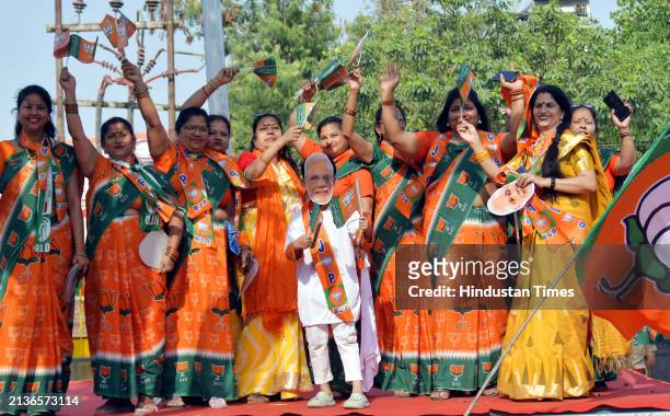 Artists and Suppoorters of BJP in the Prime Minister's road show on Ghaziabad Ambedkar Road, women workers dancing and singing on April 6, 2024 in...