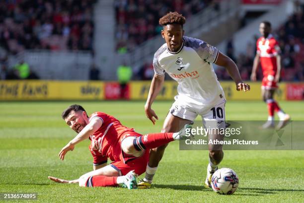 Finn Azaz of Middlesbrough and Jamal Lowe of Swansea City battle for the ball during the Sky Bet Championship match between Middlesbrough and Swansea...