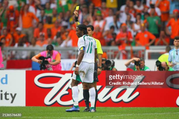June 16: Didier Drogba of Ivory Coast is shown Yellow card by Referee Oscar Ruiz during the FIFA World Cup Finals 2006 Group C match between Holland...