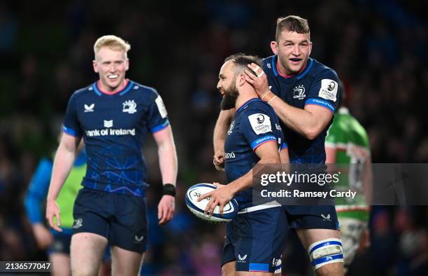 Dublin , Ireland - 6 April 2024; Jamison Gibson-Park of Leinster celebrates with team-mate Ross Molony, right, after scoring their side's third try...