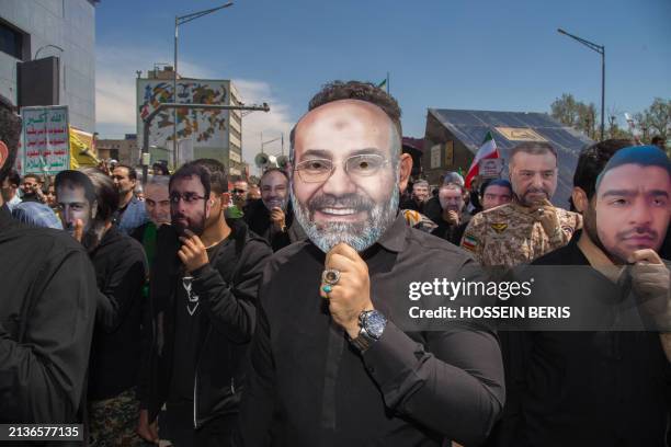 Iranians attend the annual Quds Day commemorations and the funeral of seven Revolutionary Guard Corps members killed in a strike on the country's...