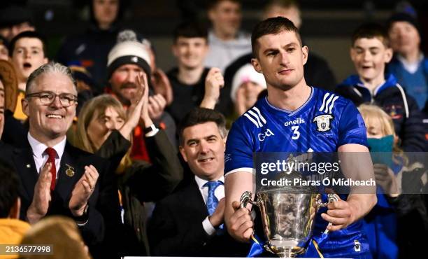 Tipperary , Ireland - 6 April 2024; Uachtarán Chumann Lúthchleas Gael Jarlath Burns, left, looks on as the Clare captain Conor Cleary lifts the...