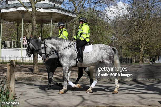 Police on horseback in Hyde Park in London on a sunny spring day. Weather forecasters are expecting warmer temperature over the next few days.