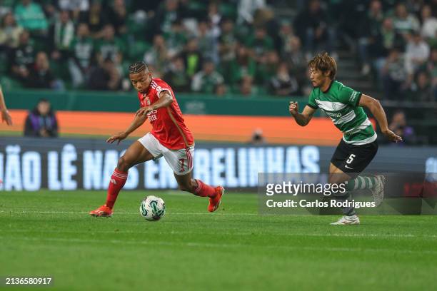 David Neres of SL Benfica tries to escape Hidemasa Morita of Sporting CP during the Liga Portugal Bwin match between Sporting CP and SL Benfica at...