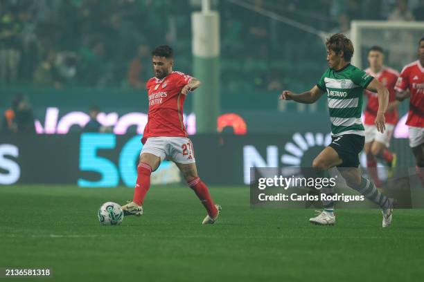 Rafa Silva of SL Benfica tries to escape Hidemasa Morita of Sporting CP during the Liga Portugal Bwin match between Sporting CP and SL Benfica at...