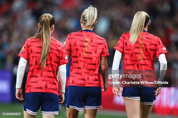 Rachel Daly and Chloe Kelly of England with her surname spelled out in sign language on her warm up top during the UEFA Women's European Qualifier...