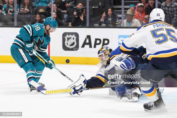 Filip Zadina of the San Jose Sharks with the puck in front of Joel Hofer of the St. Louis Blues during the second period against the St. Louis Blues...