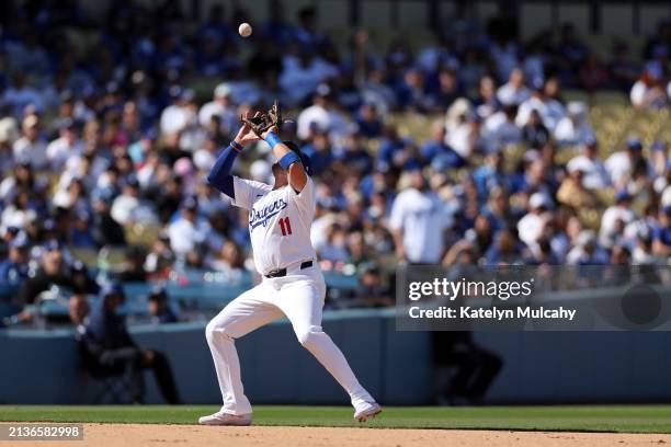 Miguel Rojas of the Los Angeles Dodgers catches a ball during the game between the St. Louis Cardinals and the Los Angeles Dodgers at Dodger Stadium...