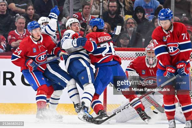 Johnathan Kovacevic of the Montreal Canadiens defends against Bobby McMann of the Toronto Maple Leafs during the second period at the Bell Centre on...
