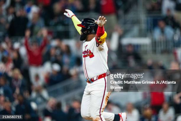 Marcell Ozuna of the Atlanta Braves celebrates hitting a home run in the fifth inning against the Arizona Diamondbacks at Truist Park on April 6,...