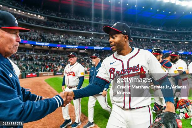 Brian Snitker and Raisel Iglesias of the Atlanta Braves celebrate after the win against the Arizona Diamondbacks at Truist Park on April 6, 2024 in...