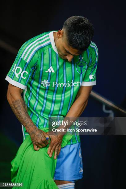 Seattle Sounders forward Raúl Ruidíaz signs a fan's shirt after a MLS matchup between CF Montréal and the Seattle Sounders on April 6, 2024 at Lumen...