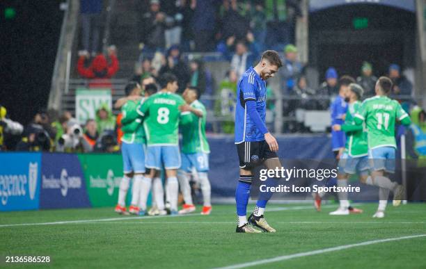 Montréal defender Gabriele Corbo hangs his head as the Seattle Sounders celebrate in the background during a MLS matchup between CF Montréal and the...