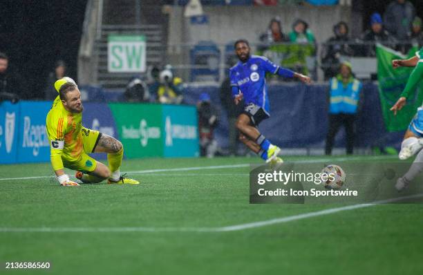 Seattle Sounders goalkeeper Stefan Frei slides as he prepares to stop a shot on the net during a MLS matchup between CF Montréal and the Seattle...