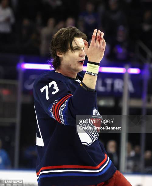 Matt Rempe of the New York Rangers leaves the ice following a first period fight against Kurtis MacDermid of the New Jersey Devils at Madison Square...