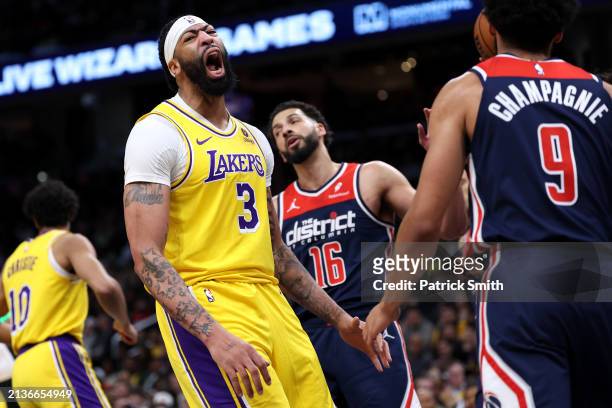 Anthony Davis of the Los Angeles Lakers reacts after scoring a point against the Washington Wizards during the first half at Capital One Arena on...