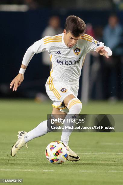 Riqui Puig of the LA Galaxy drives the ball during an MLS regular season match between St. Louis City SC and Los Angeles Galaxy at Dignity Health...