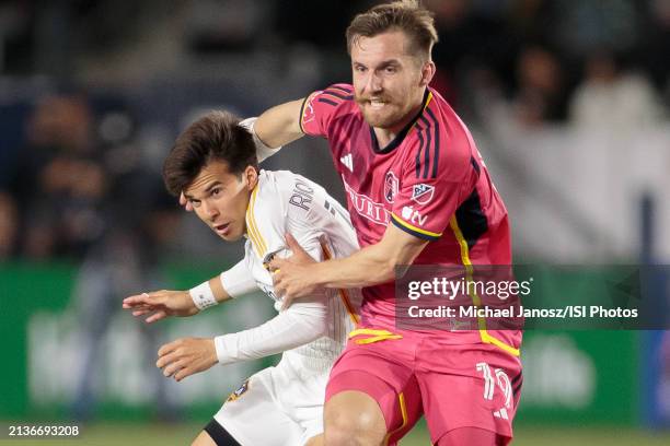 Riqui Puig of the LA Galaxy competes with Indiana Vassilev of St. Louis City SC during an MLS regular season match between St. Louis City SC and Los...
