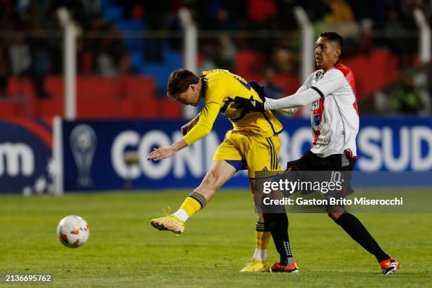 Jabes Saralegui of Boca Juniors and Samuel Galindo of Nacional Potosi battle for the ball during the Copa CONMEBOL Sudamericana 2024 group D match...