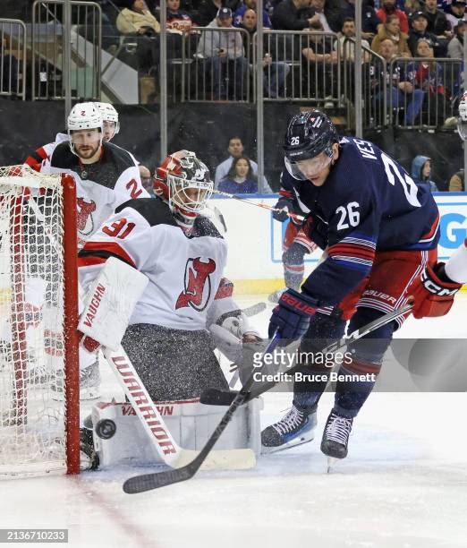 Kaapo Kahkonen of the New Jersey Devils makes the second period save on Jimmy Vesey of the New York Rangers at Madison Square Garden on April 03,...