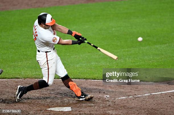 James McCann of the Baltimore Orioles hits a double in the eighth inning against the Kansas City Royals at Oriole Park at Camden Yards on April 03,...