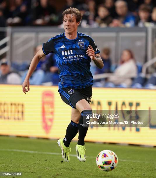 Benji Kikanovi of San Jose Earthquakes dribbles the ball up the left wing and looks for a centering pass during a game between Seattle Sounders FC...