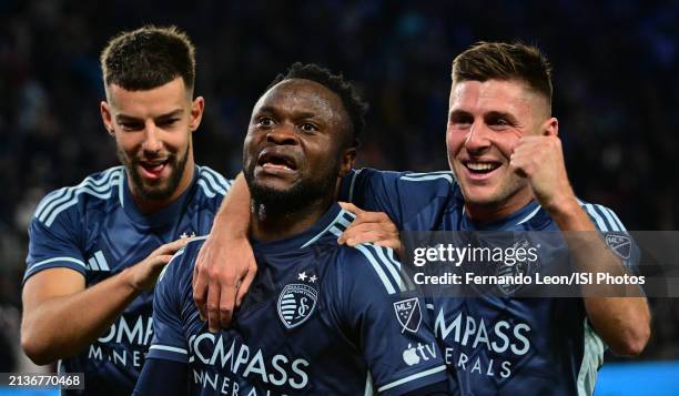 Robert Voloder, Willy Agada and Remi Walter of Sporting Kansas City celebrate Agadas goal at the end of the first half during a game between Los...