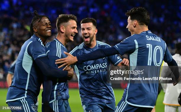 Dany Rosero, Nemanja Radoja, Robert Voloder and Daniel Salloi of Sporting Kansas City celebrate Radoja's goal in the first half during a game between...