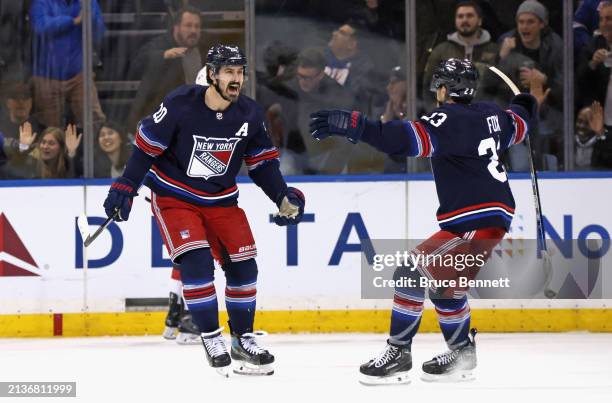 Chris Kreider of the New York Rangers celebrates his third period game-winning goal against the New Jersey Devils at Madison Square Garden on April...