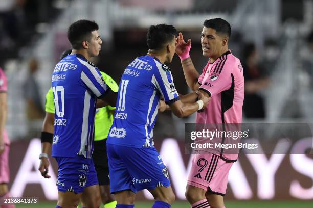 Maximiliano Meza of Monterrey and Luis Suárez of Inter Miami exchange words during the second half in the quarterfinals of the Concacaf Champions Cup...
