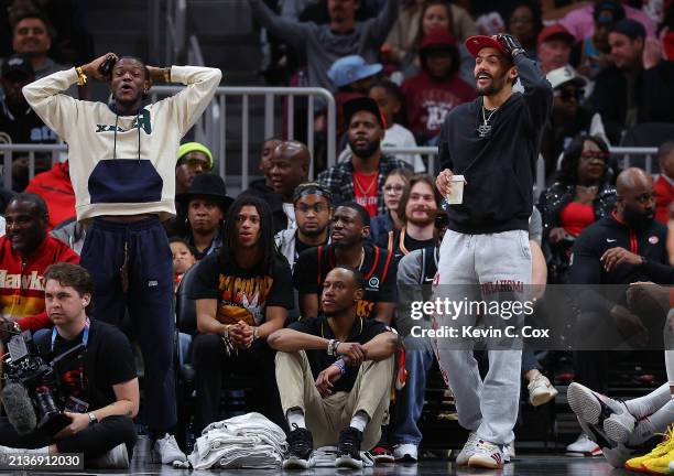 Trae Young of the Atlanta Hawks reacts on the bench against the Detroit Pistons during the second quarter at State Farm Arena on April 03, 2024 in...