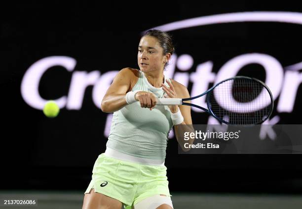 Caroline Dolehide of the United States returns a shot to Beatriz Haddad Maia of Brazil on Day 3 of the WTA 500 Credit One Charleston Open 2024 at...