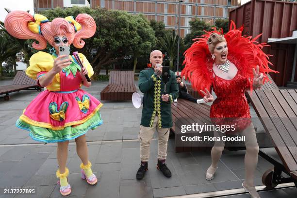 Drag Queens Kita Mean and Anita Wigl'it react to a lone protester outside the opening ceremony of the 2024 Rainbow Games on April 04, 2024 in...
