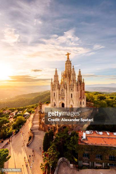 sagrat cor church and tibidabo mountain at sunset, aerial view, barcelona, spain - sagrat cor stock-fotos und bilder